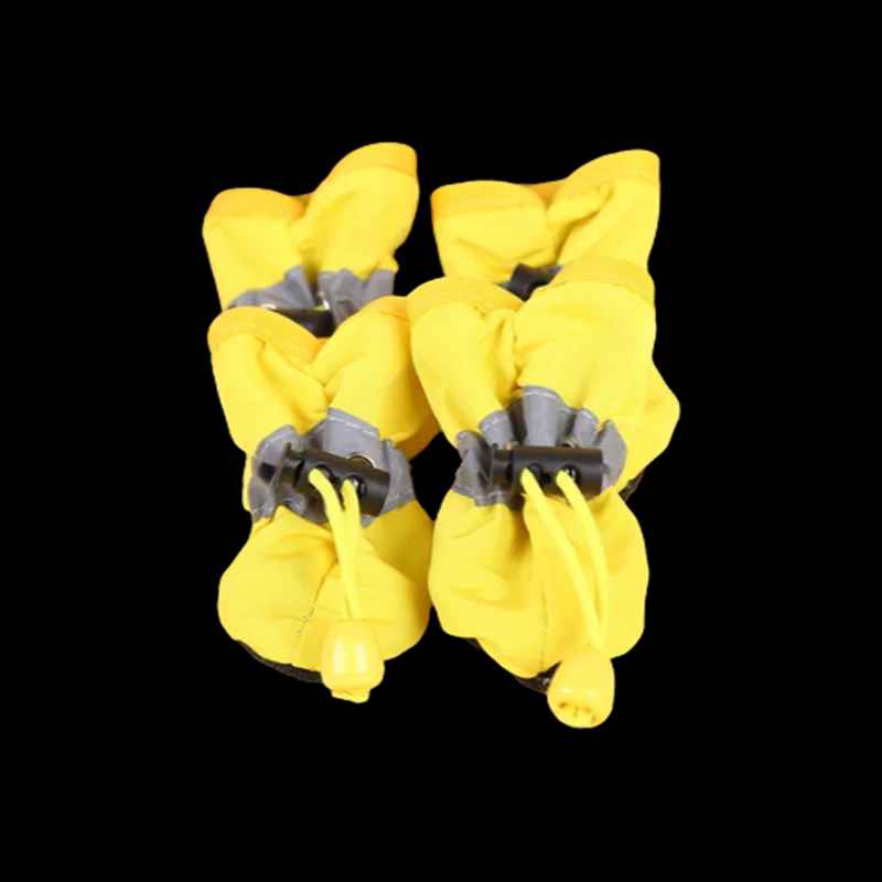 Puppy wearing waterproof rain boots with paw protection
